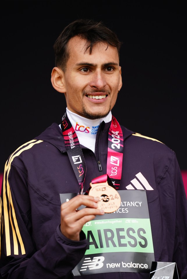 Emile Cairess with medal after the men's elite race during the TCS London Marathon. Picture date: Sunday April 21, 2024. PA Photo. See PA story ATHLETICS London. Photo credit should read: John Walton/PA Wire. RESTRICTIONS: Use subject to restrictions. Editorial use only, no commercial use without prior consent from rights holder.