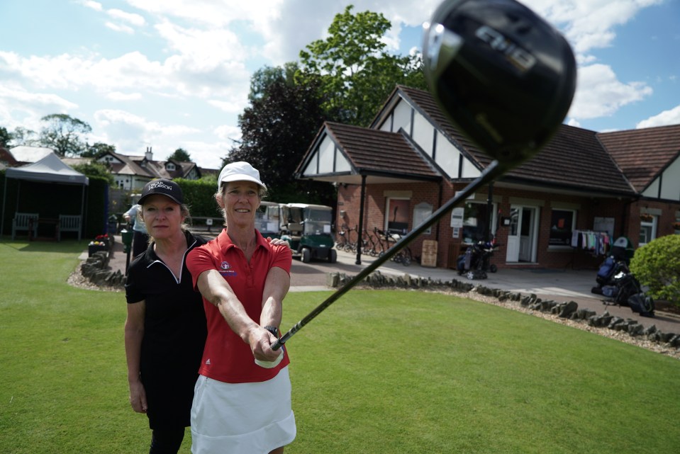 Mandi relies on a guide to help her line up her shots when out on the course