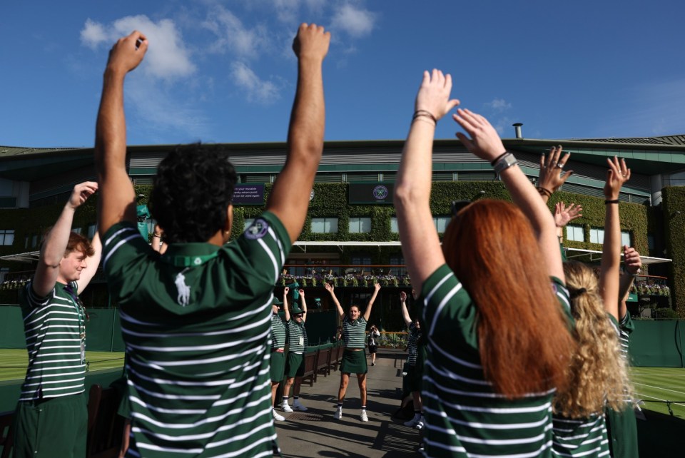 LONDON, ENGLAND - JULY 01: Ball boys and girls warm up together ahead of day one of The Championships Wimbledon 2024 at All England Lawn Tennis and Croquet Club on July 01, 2024 in London, England. (Photo by Julian Finney/Getty Images)