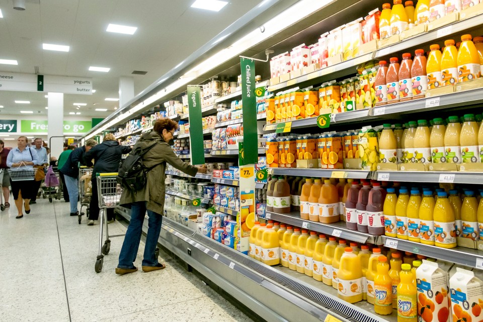 GH7CPX Customers shopping in a Morrisons supermarket.