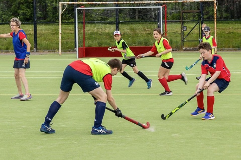 Head-on tackle … some members of the team compete in the West District Hockey League