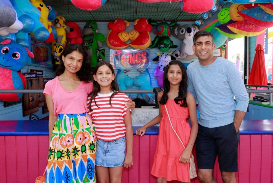 Britain's Prime Minister Rishi Sunak, with his wife Akshata Murty and children Krishna (2L) and Anoushka (2R), pose for a photograph whilst on holiday, at Santa Monica Pier in Santa Monica, California on August 3, 2023. (Photo by Emma McIntyre / POOL / AFP) (Photo by EMMA MCINTYRE/POOL/AFP via Getty Images)