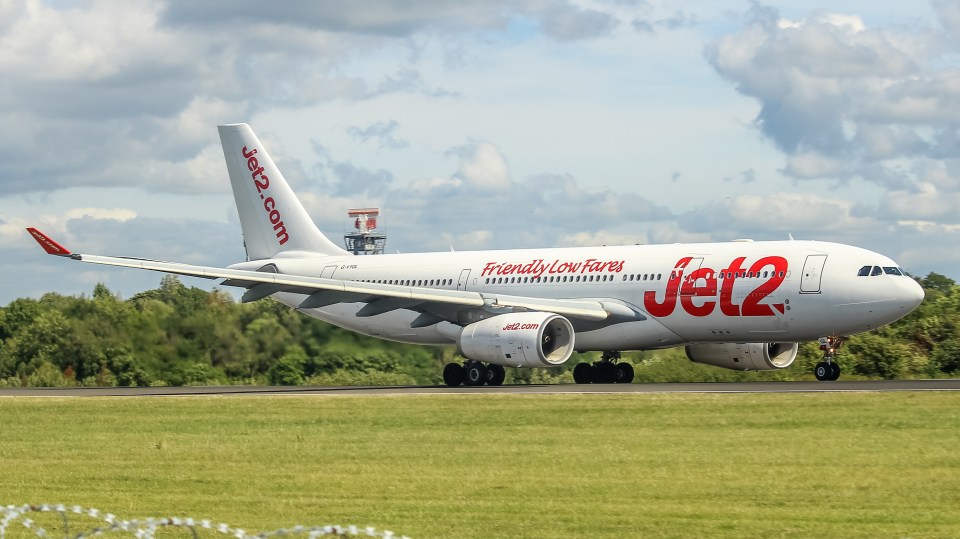 a jet2 airplane is taking off from a runway