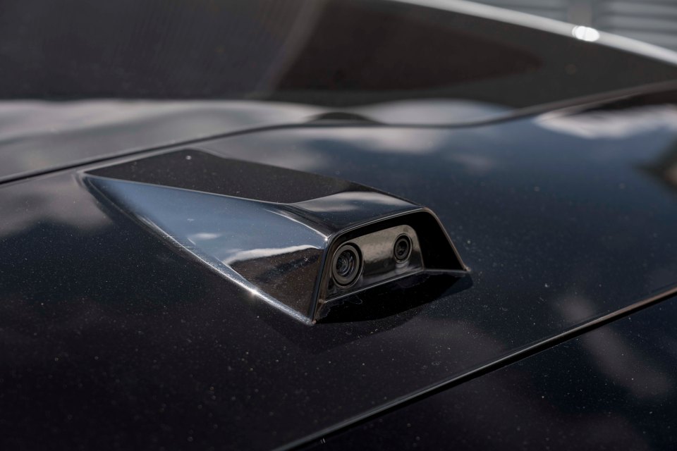 There is a roof-mounted camera that replaces the rear window