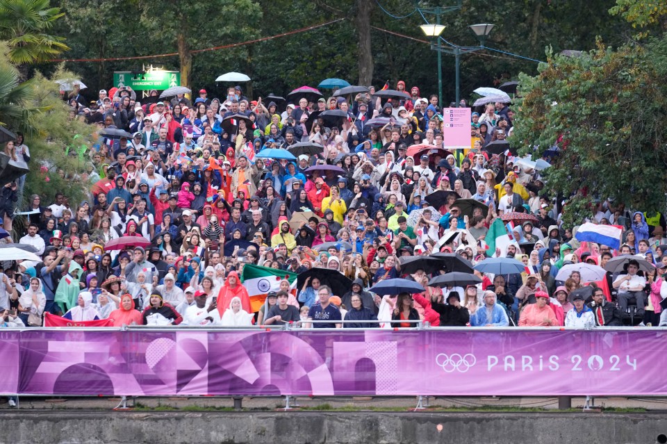 The umbrellas were soon out as the rain poured down