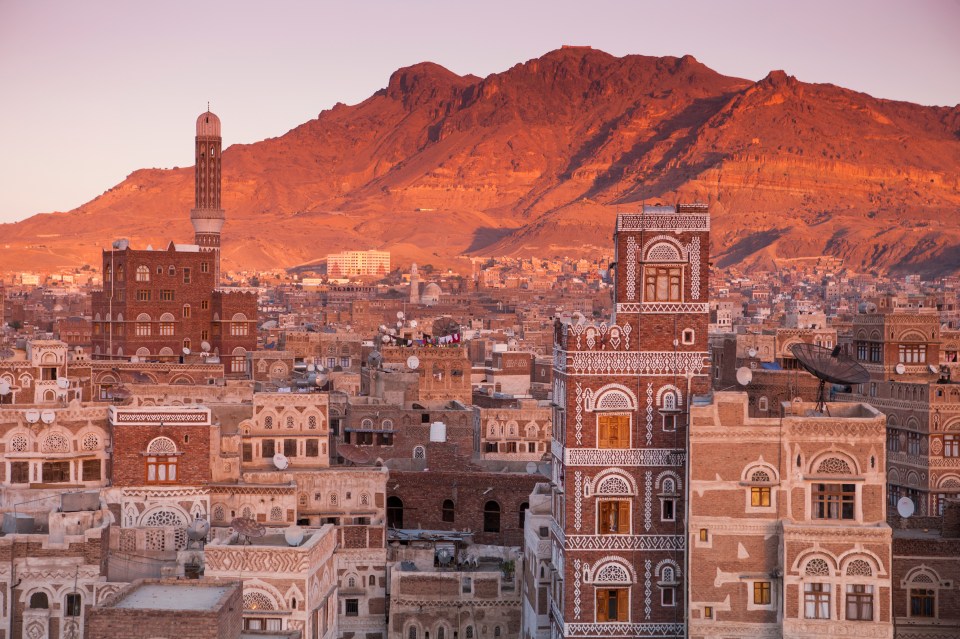 The red mountains is in contrast to the white beaches found in the island.