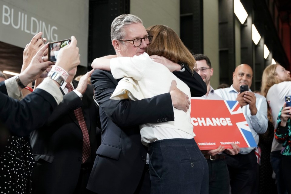 Sir Keir Stamer and his wife hugging after Labours win at the General Election