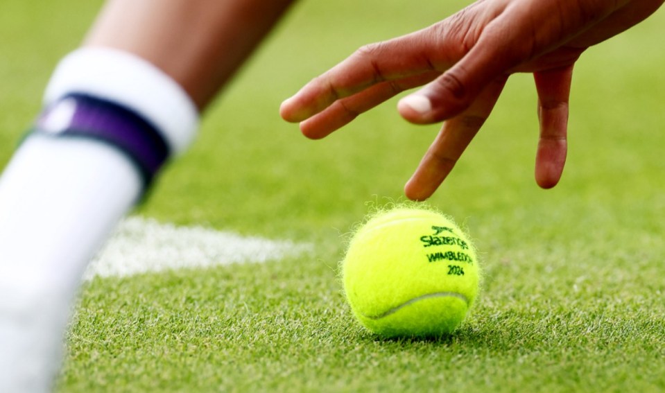 Mandatory Credit: Photo by James Marsh/REX/Shutterstock (14565034u) A ball boy picks up a ball. Wimbledon Tennis Championships, Day 1, The All England Lawn Tennis and Croquet Club, London, UK - 01 Jul 2024