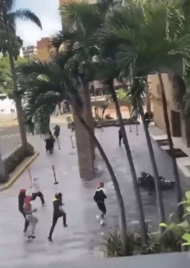 National Guardsmen on motorbikes were chased through the streets by protesters