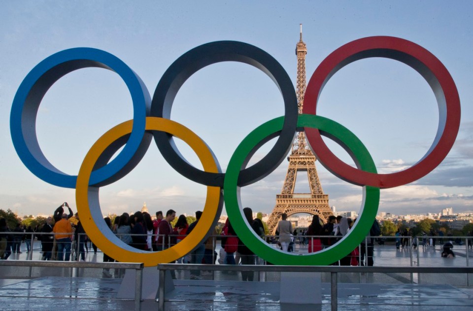 The Olympic rings overlook the Eiffel Tower