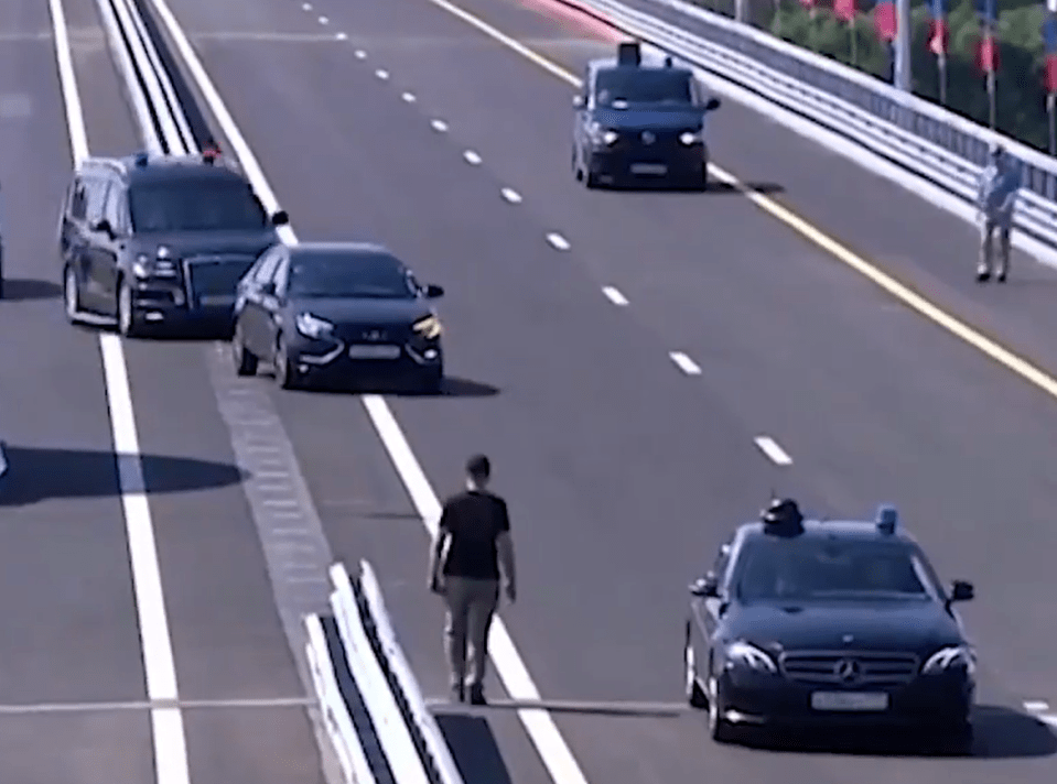 The Russian leader was seen indicating left in a bid to get on the highway