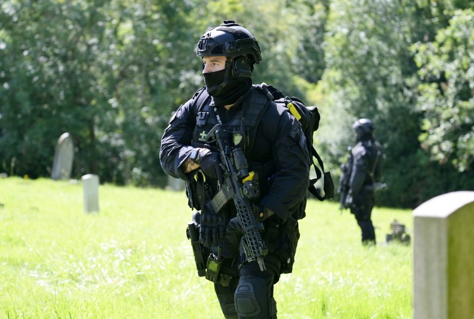 Armed police search Lavender Hill Cemetery in Enfield