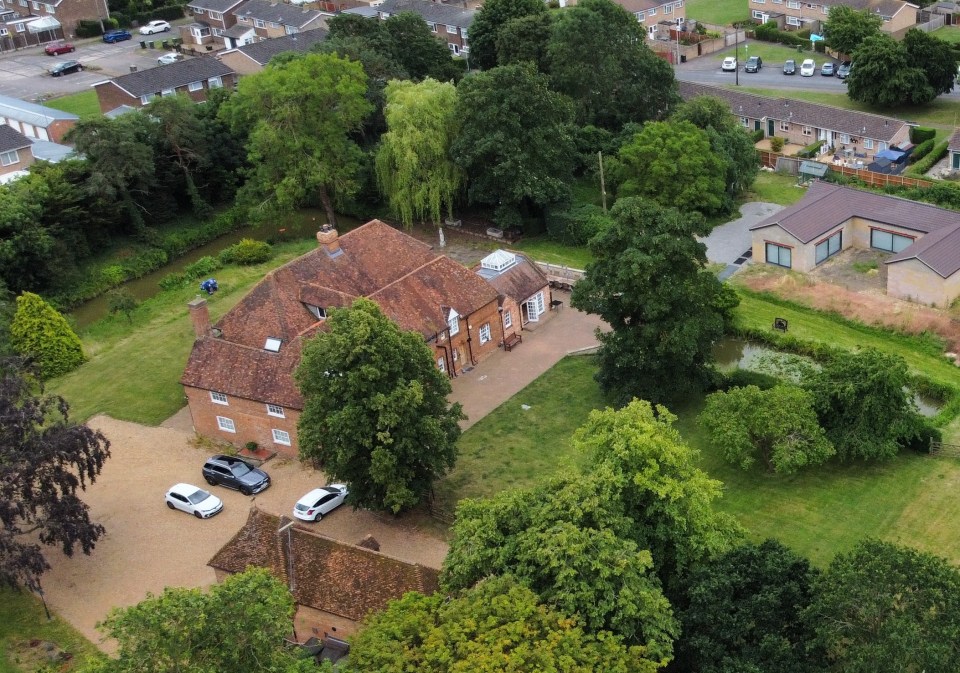 The family’s seven-bedroom home alongside the spa before it was removed