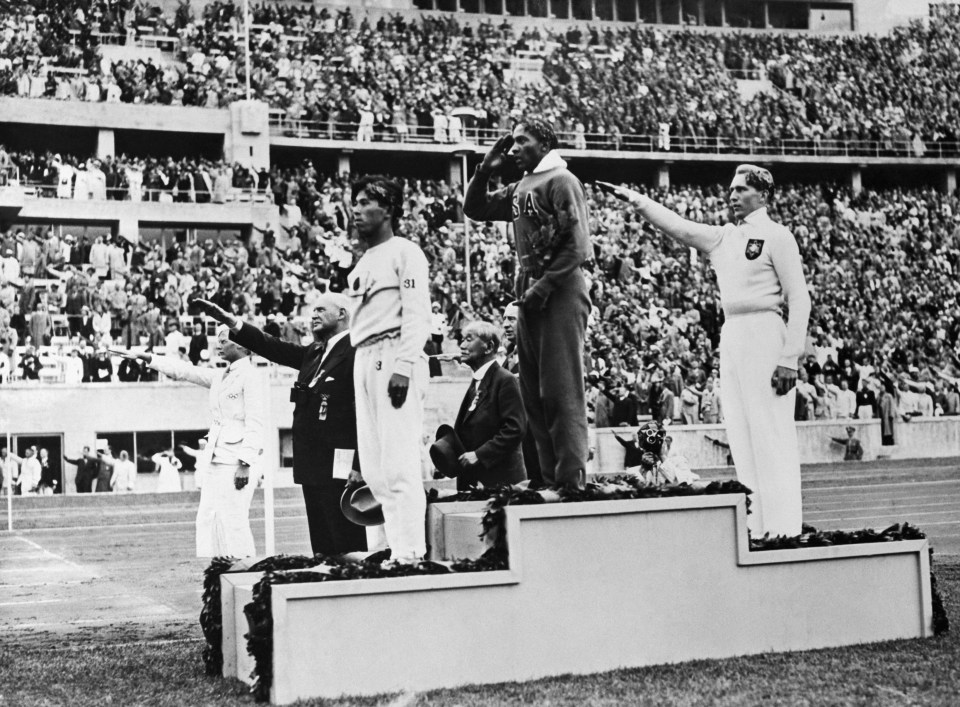 a man wearing a jersey with the number 33 on it salutes