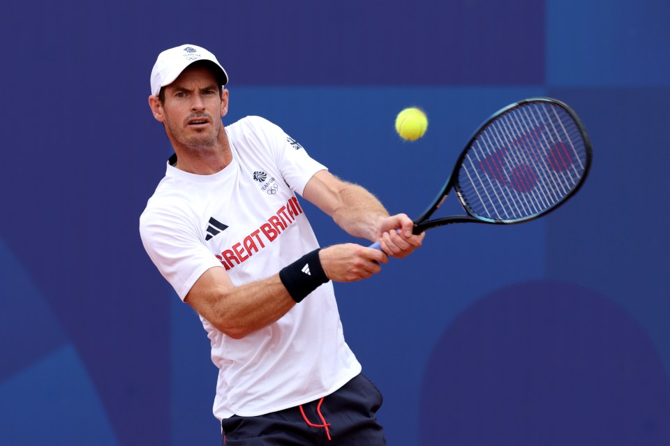 a man playing tennis with a shirt that says great britain