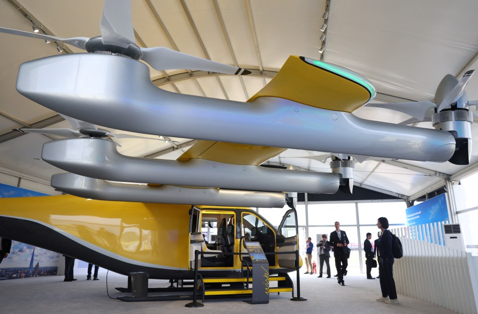 a model of a flying car with a yellow door