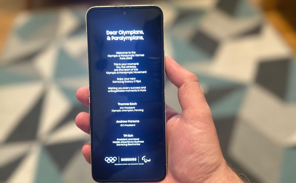 A message greets Olympians when they switch the phone on