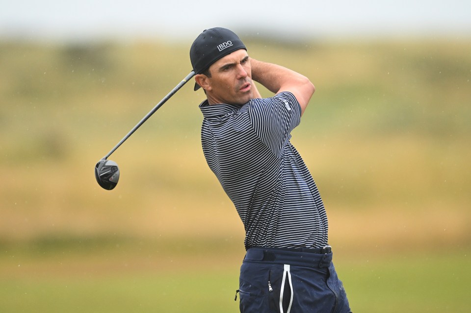 a man wearing a hat that says ibdo is swinging a golf club