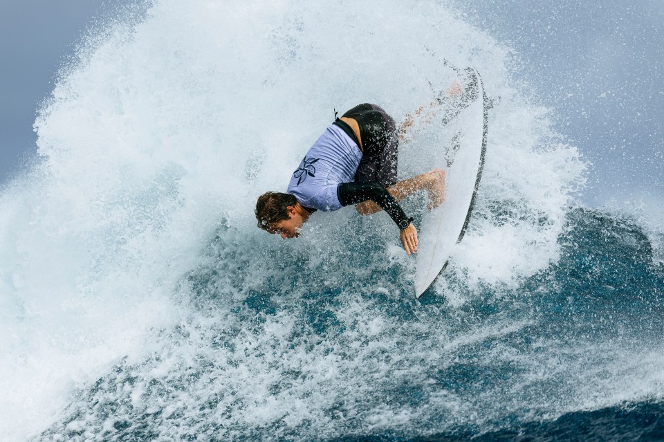 Billy Stairmand of New Zealand surfs a wave during a training session