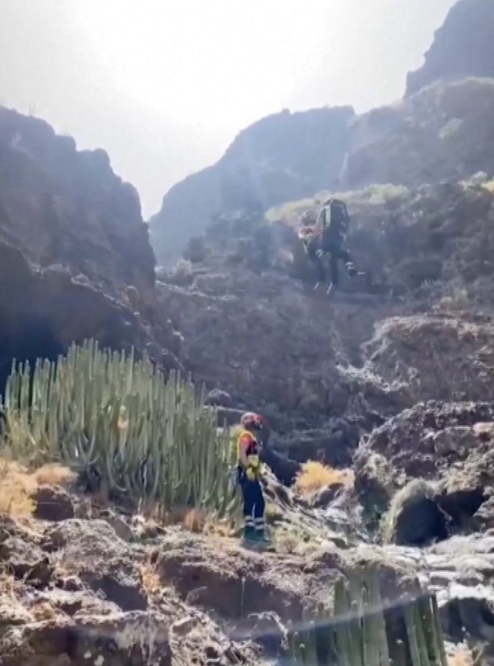 The body was found in a 'very inaccessible area' after rescue workers were forced to battle against the rough terrain