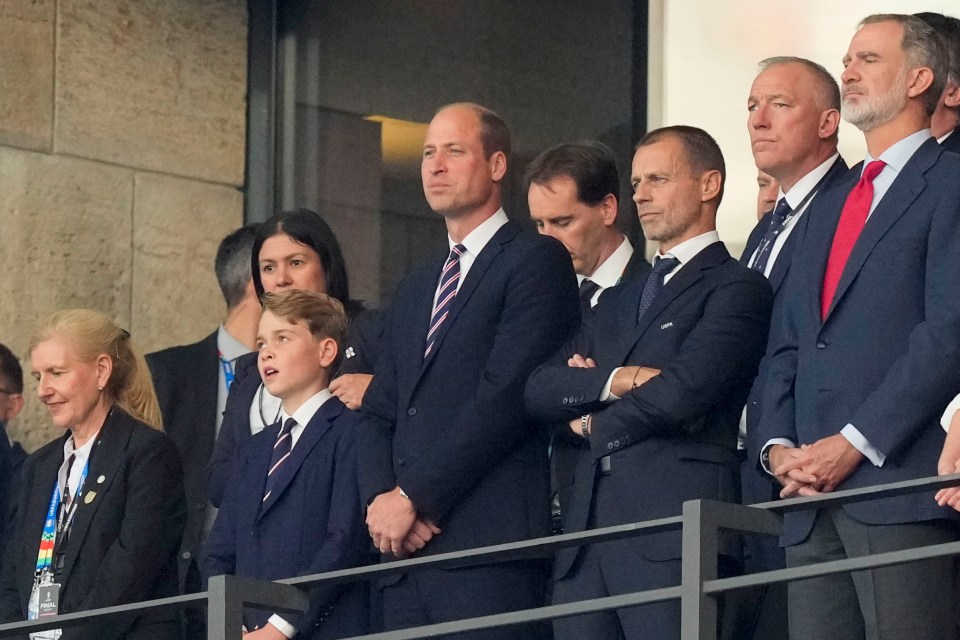 The royals look on