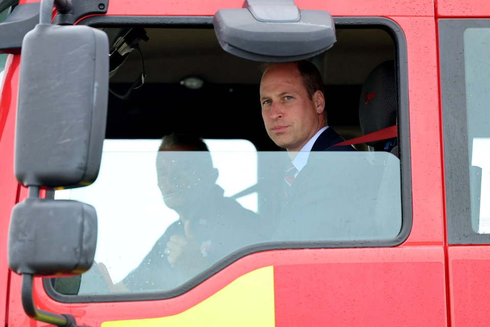 Prince William manned a water pump after leaping on a fire engine to tackle a burning plane