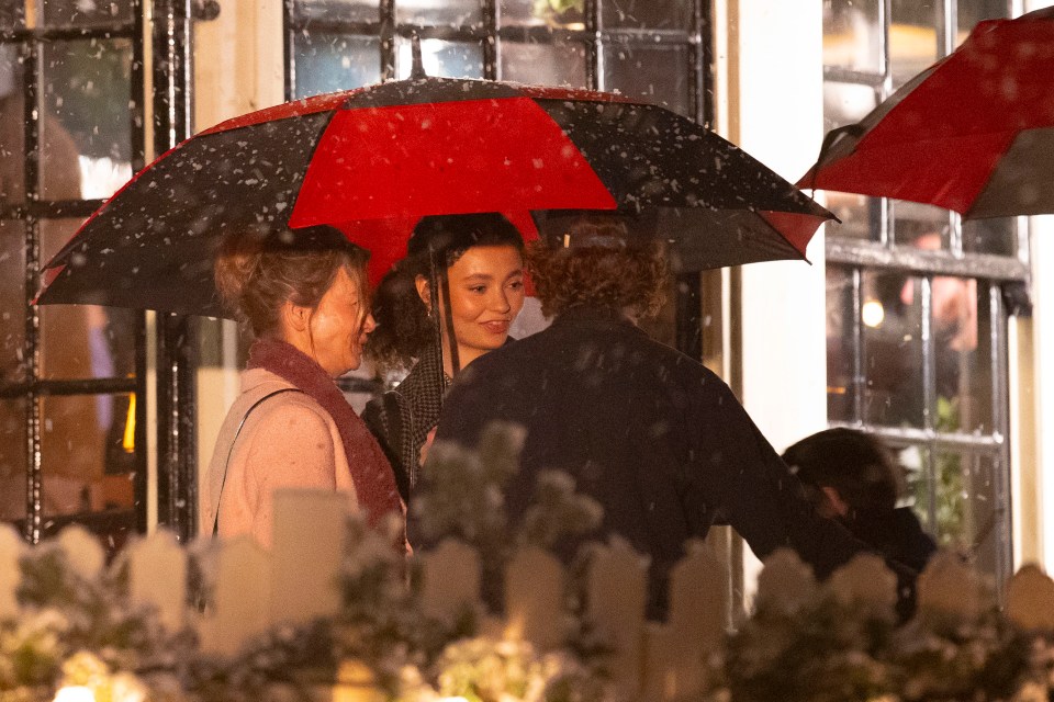 Zellweger was seen sheltering under an umbrella from the artificial snow