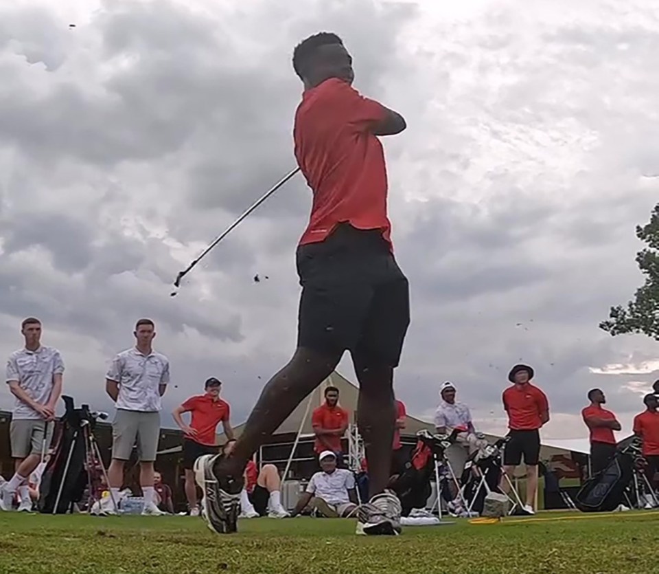 Bukayo Saka takes a swing with his golf club