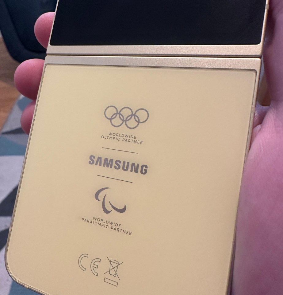 Olympic and Paralympic logos are stamped on the back