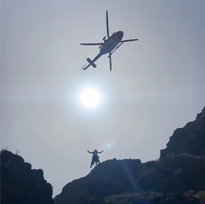 The moment rescue workers perform a helicopter airlift in the area where a body was found in the hunt for Jay