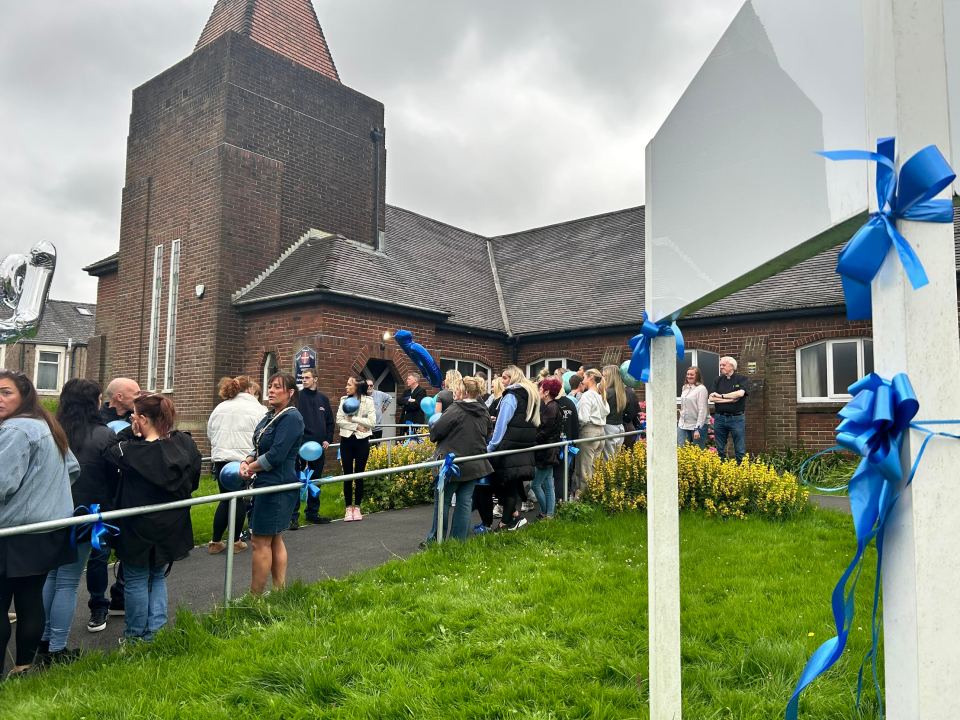 Blue ribbons lined the streets near the church in Oswaldtwistle