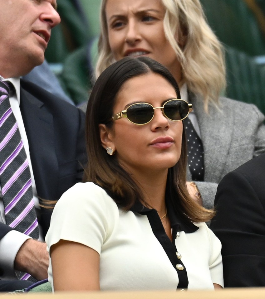 She rocked a white blouse with sunglasses