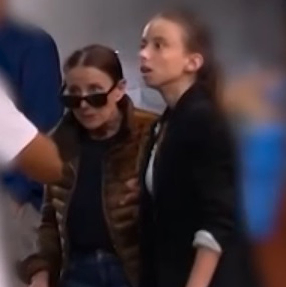 two women wearing sunglasses are standing next to each other