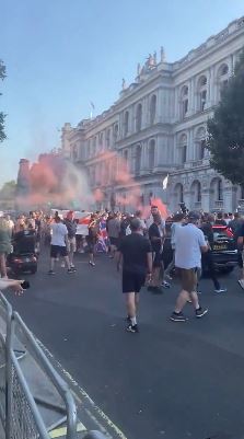 Demonstrators lit flares as they marched in the capital