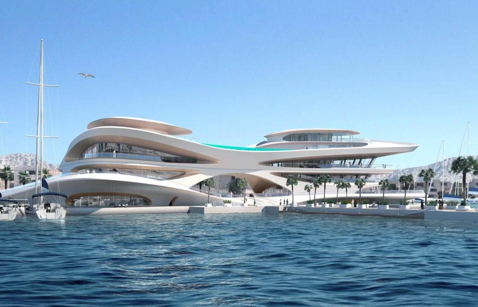 Another plan picture shows a futuristic building overlooking the ocean