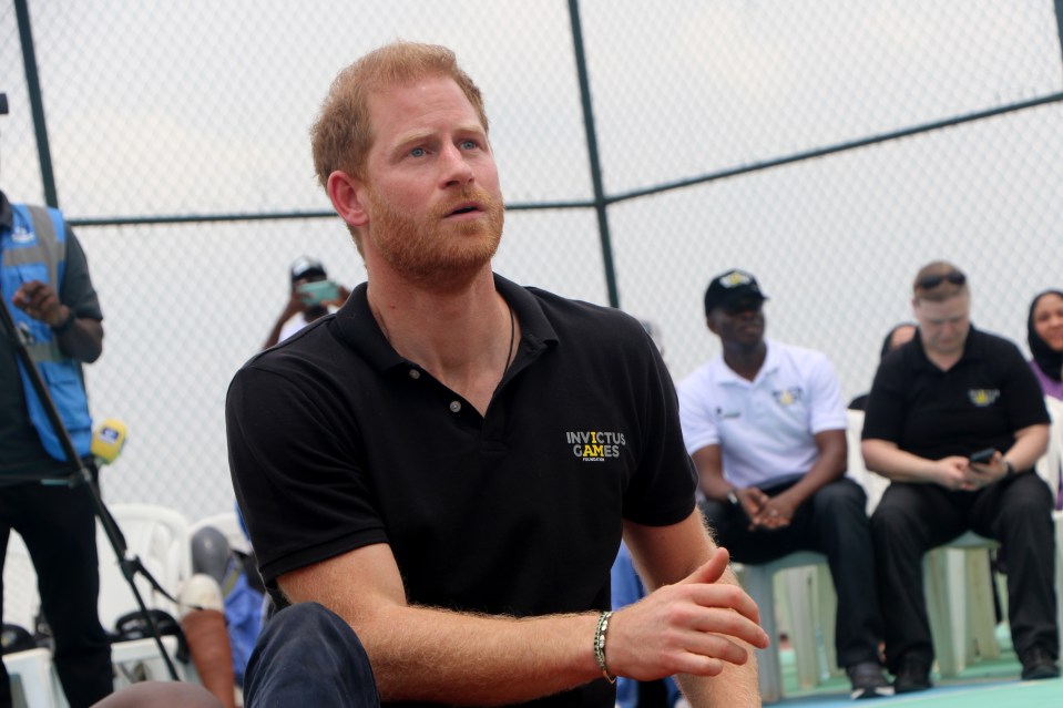 The Duke and Duchess of Sussex, at an exhibition sitting volleyball match at Nigeria Unconquered during their tour in May