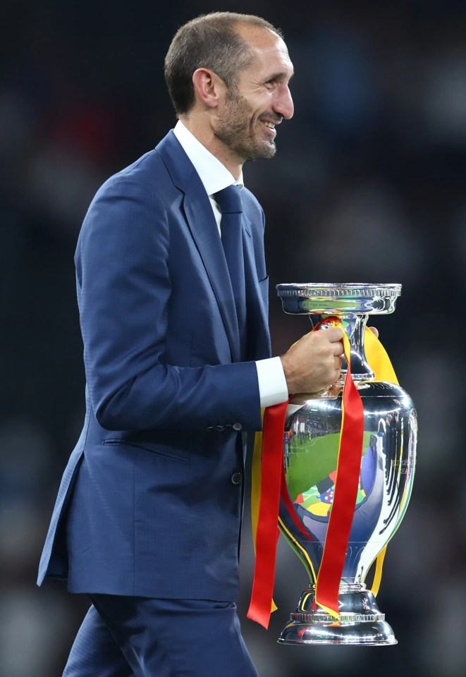 He beamed as he walked out with the trophy following Spain’s win over England