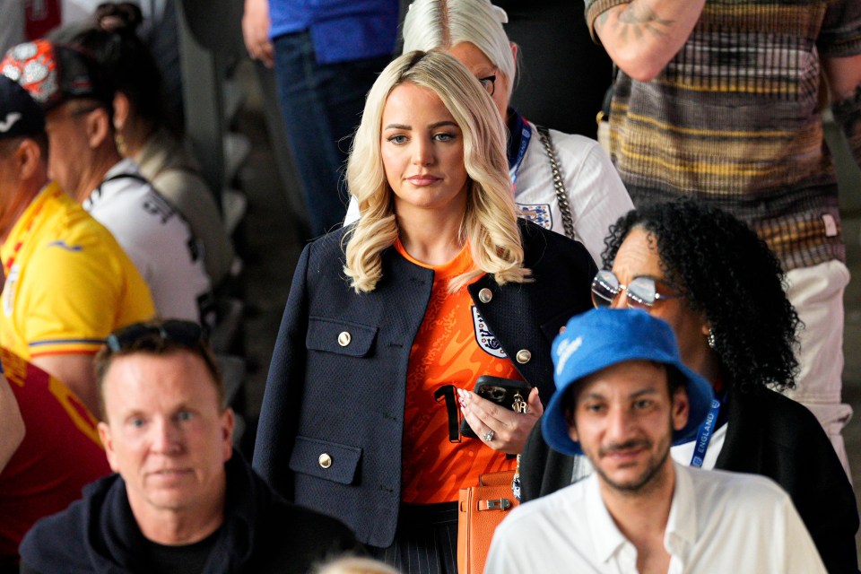 Jordan Pickford’s partner Megan Davison wore an orange keeper’s jersey