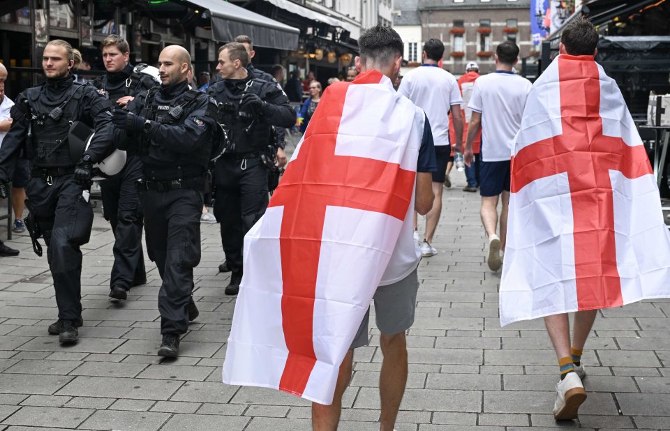 A pair of English fans cross paths with the local Polizei