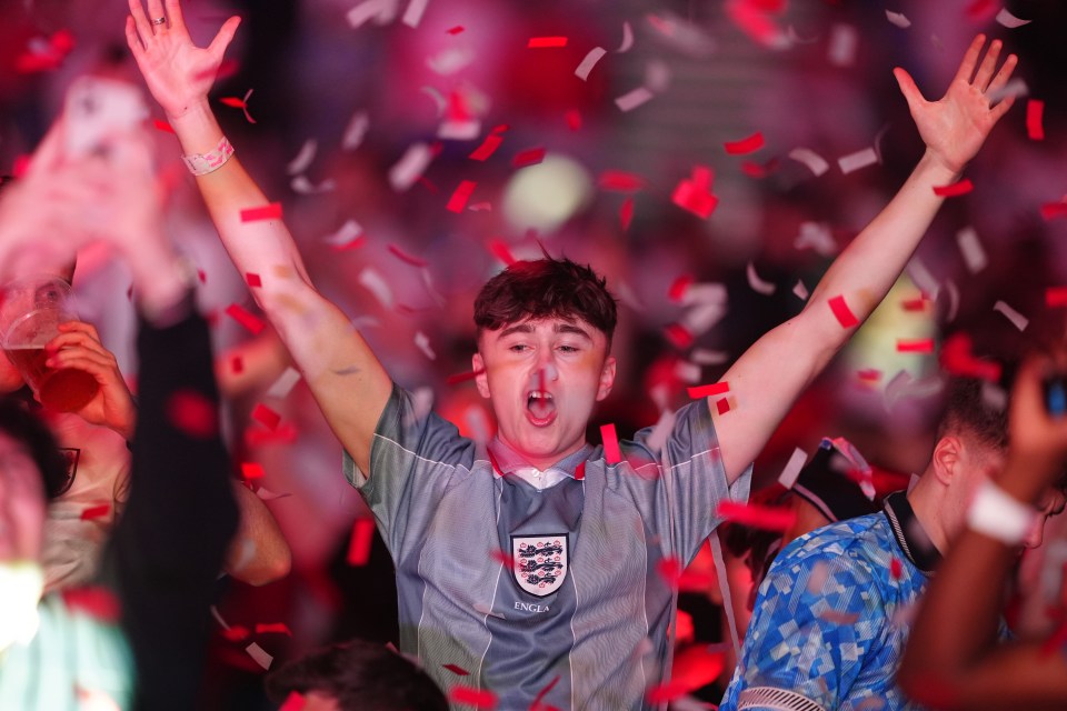 England fans in Manchester celebrate Ollie Watkin’s goal against the Netherlands in the Euro semi-final game