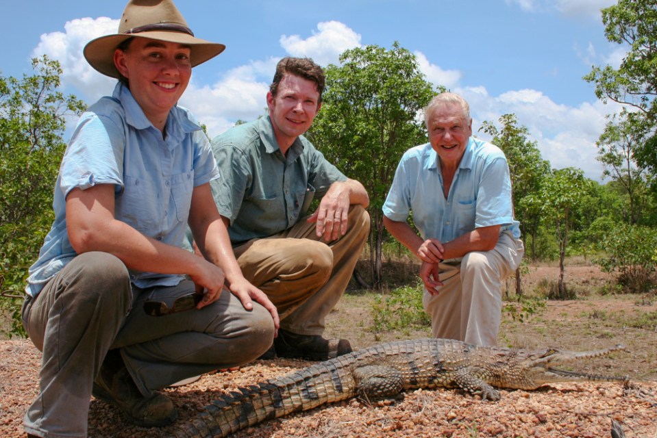 Adam (centre) with his ex-wife Erin (left) and David Attenborough (right) in Australia