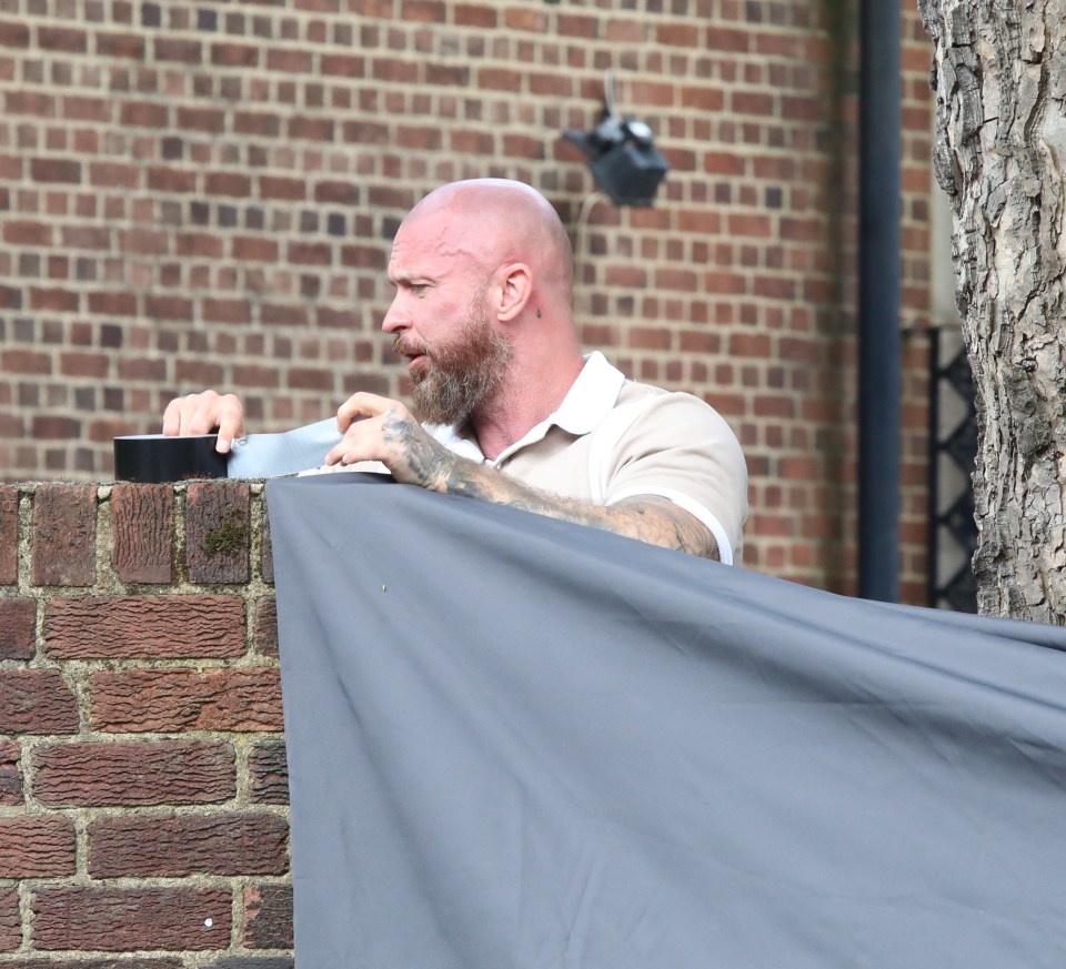 A large tarpaulin has been erected to keep unwanted visitors out