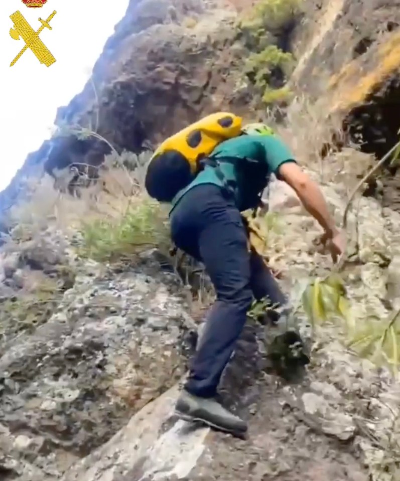 Rescuers were seen scouring rock faces as they faced the 'dangerous' terrain