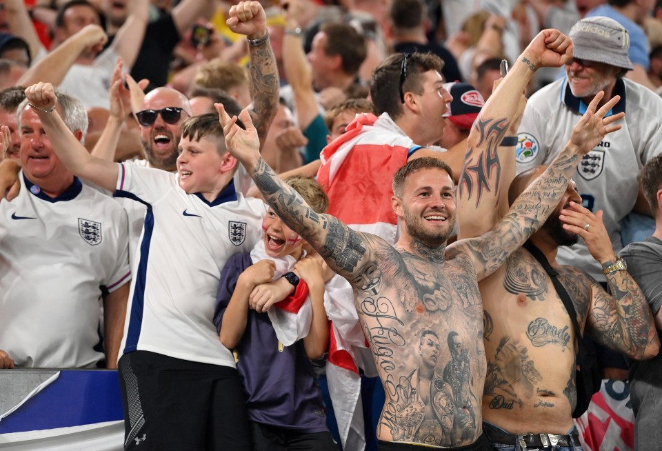 Jubilant fans celebrating in the stadium