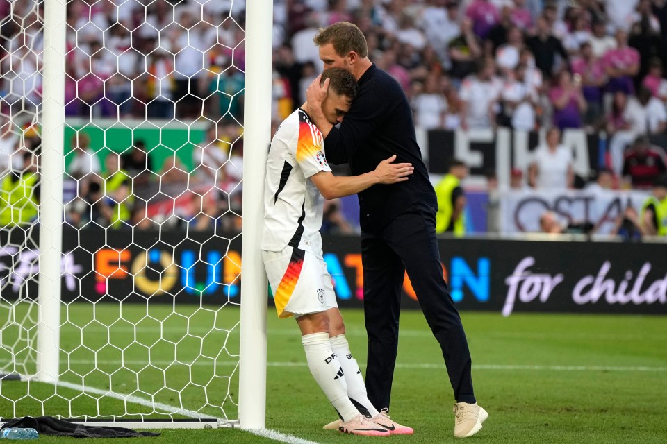 Joshua Kimmich is consoled by manager Julian Nagelsmann