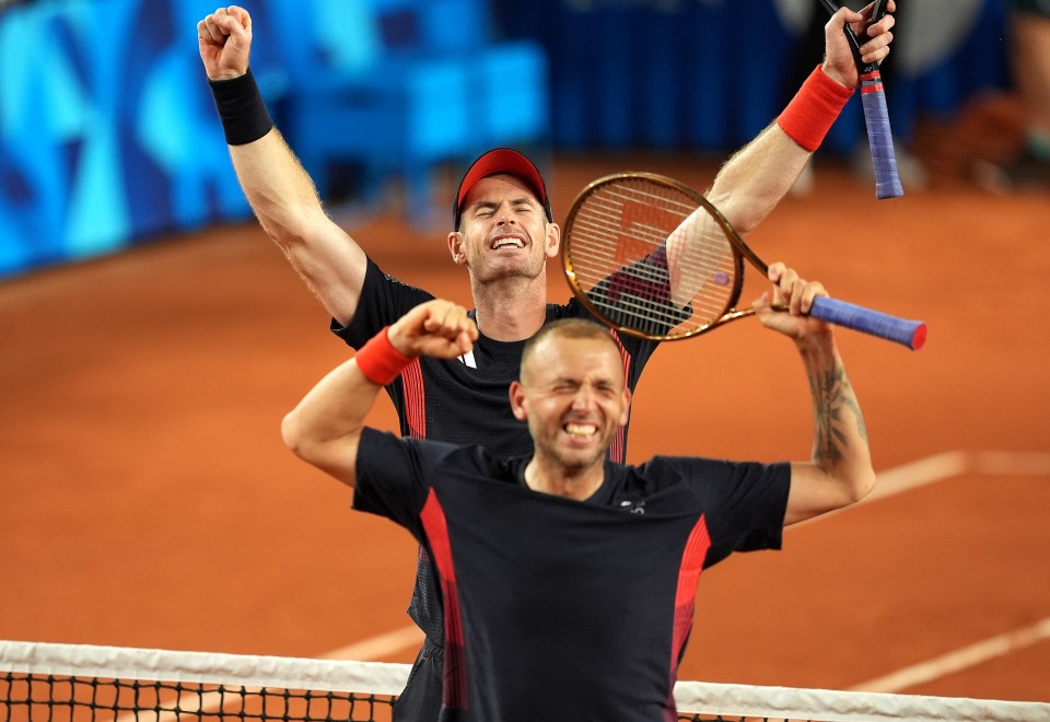 two tennis players are holding their rackets in the air