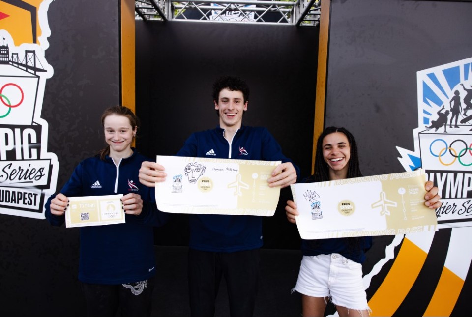 three people holding up tickets for the pic series