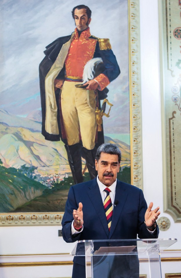 Maduro speaking during a televised message in Caracas in front of a painting of the country’s founding father Simon Bolivar