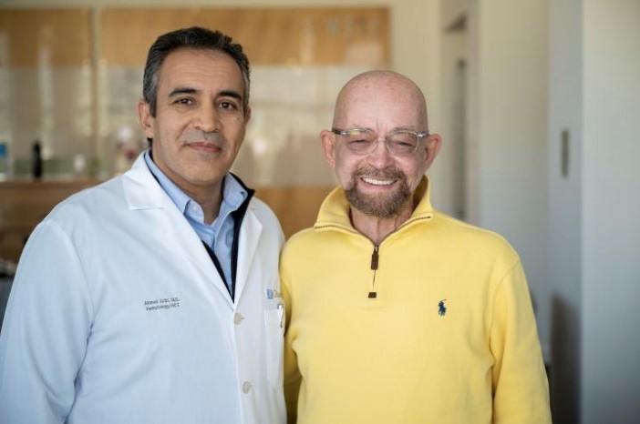 Paul Edmonds (right) who is considered 'cured' of HIV, with Dr Ahmed Aribi