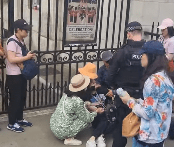 She then appears to faint and is later seen sitting on the floor against the railings